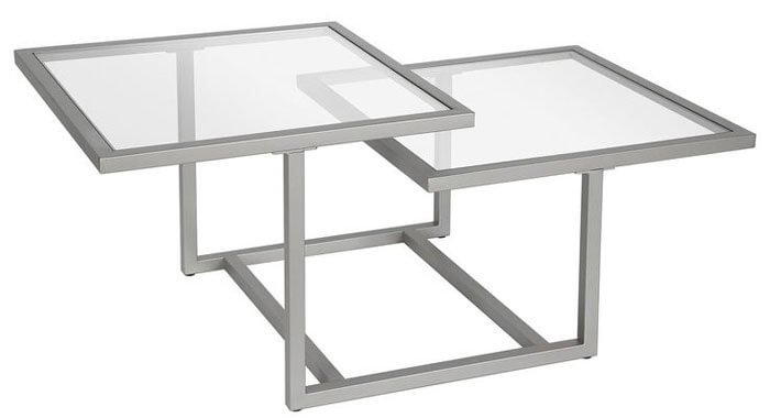 Mesa de centro en herrería con cristal con diseño asimétrico en color plateado Mesa de centro en herrería con cristal con diseño asimétrico en color plateado